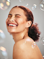 Beauty, bubble and a happy woman in studio for skincare cosmetics, natural skin glow and...