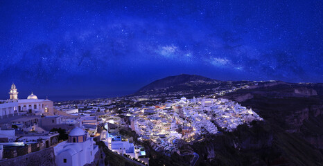 The Milky way galaxy with star in the night t fira town on Santorini island, Greece