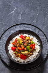 crispy ground beef with stir-fried veggies in bowl