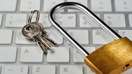 lock with keys on a computer keyboard, close-up