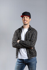 Man in casual clothes posing looking at camera isolated on gray background