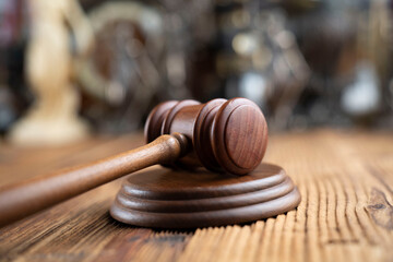 Law concept. Jugde’s gavel on rustic wooden desk.