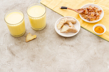 Yellow turmeric latte coffee. Golden milk with turmeric and cinnamon