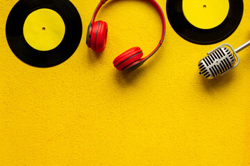 Podcasts or music concept with vinyl records and microphone, top view
