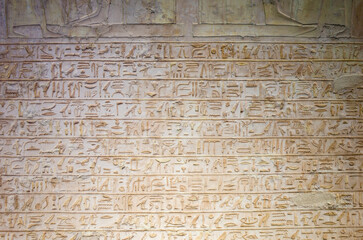 Stone wall completely inscribed with ancient Egyptian hieroglyphs, ancient civilization historical pattern