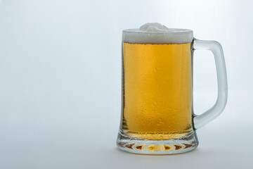 mug full of beer with foam