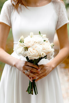 wedding bouquet in the hands of the bride close-up
