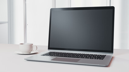 Fototapeta premium Laptop Mock-Up white color on work desk and cup coffee in office white room. Designed in minimal concept. Can be used in education or business background. 3d render.