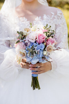 wedding bouquet in the hands of the bride.
