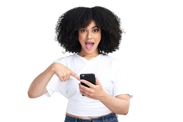 An attractive young woman using a smartphone and looking shocked isolated on a PNG background.
