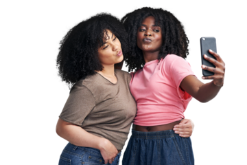 PNG Studio shot of two young women using a smartphone to take selfies