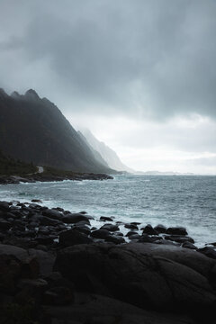 Norway fjords during a storm. Sea on a moody cloudy weather, vertical photo in Lofoten Islands