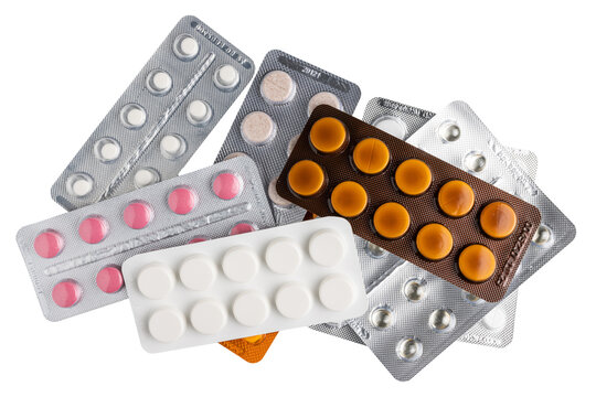 Various pills and tablets in a blister packs isolated on transparent background, top view, healthcare and medicine concept