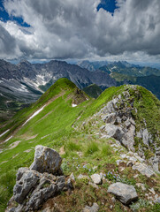 Between Italy and Austria: on the top of mountain near Volaia Lake Raunchkofer Mountain (Lago di Volaia Monte). Mountain hiking Trail Road.