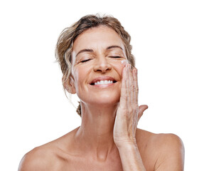 A mature woman posing with moisturiser on her face isolated on a transparent PNG background