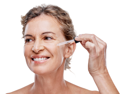 A mature woman posing with a serum dropper against her face isolated on a transparent PNG background