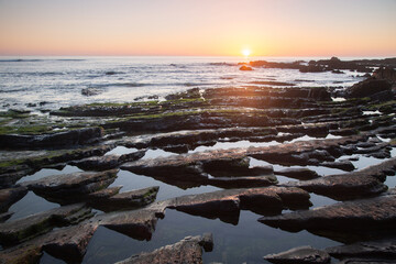 Sunset on Rocks at Amoreira Beach; Algarve; Portugal