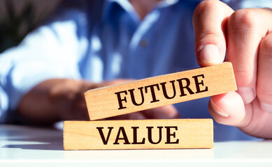 Closeup on businessman holding a wooden block with 