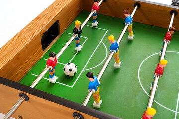 Close-up view of a table football game in progress