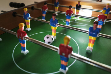 Fototapeta premium Table football game in progress creates a sense of excitement and competition