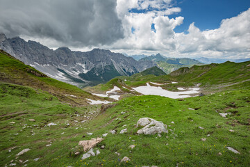 Fototapeta premium Between Italy and Austria: on the top of mountain near Volaia Lake Raunchkofer Mountain (Lago di Volaia Monte). Mountain hiking Trail Road.