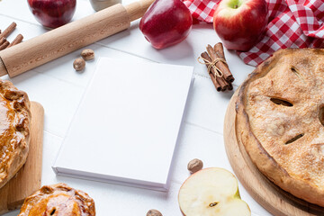 blank cooking book cover mockup with apple pie, meat pie and seasonal fruit