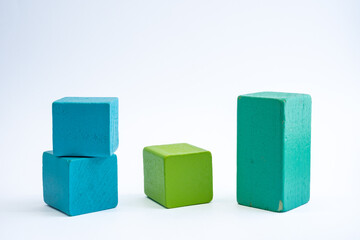 Obraz premium Solid wooden block with white isolated background. Toddler toys, creativity, innovative, brain development concept. 
