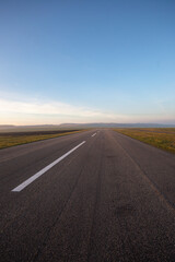 Fototapeta na wymiar Small empty field airport with asphalt runway