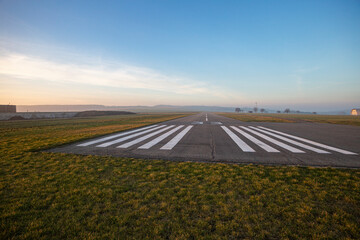 Small empty field airport with asphalt runway
