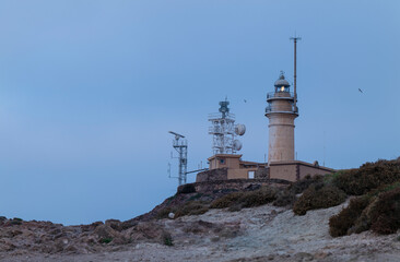 Fototapeta na wymiar Lighthouse on cliff. Cabo de Gata, Almeria, Spain