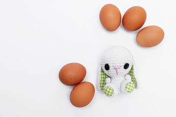 Easter bunny or rabbit with egg on white background. Easter holiday concept. photo. copy space