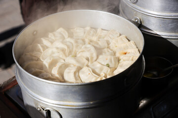 Vegetarian traditional dumpling momos. Tibetan momo Street food in Mall road Kullu Manali Himachal Pradesh India.	