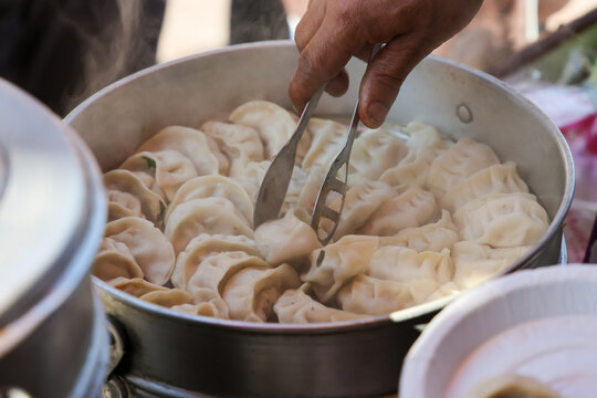 Vegetarian traditional dumpling momos. Tibetan momo Street food in Mall road Kullu Manali Himachal Pradesh India.	