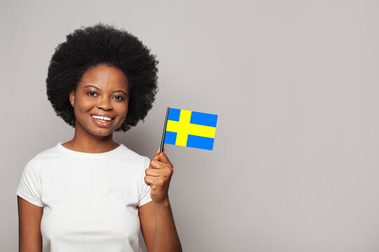Swedish woman holding flag of Sweden Education, business, citizenship and patriotism concept