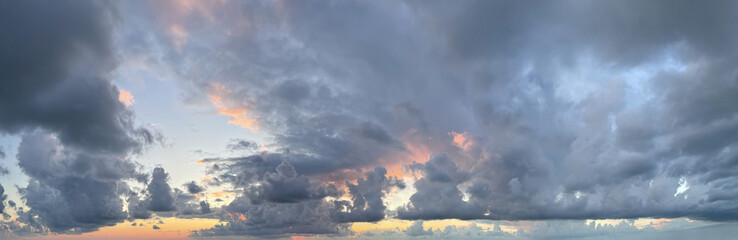 Fototapeta na wymiar Vibrant color panorama of sky with dramatic cloud. Beautiful sunset cloudscape. Panoramic nature background