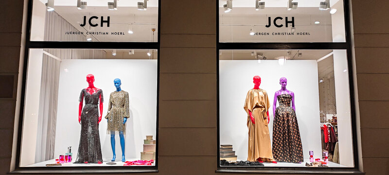 Austria, Vienna - January 9, 2023: JCH fashion store for an Austrian designer Juergen Christian Hoerl. Multi-colored LGBT mannequins in dresses in a shop window