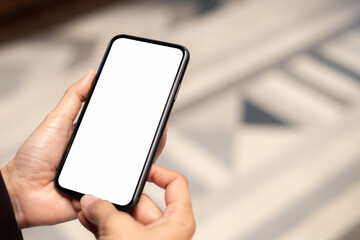 cell phone blank white screen mockup.hand holding texting using mobile on desk at office.background empty space for advertise.work people contact marketing business,technology