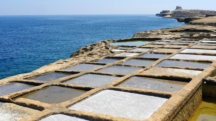 Sea salt production on the island of Gozo.  Ancient salt pans