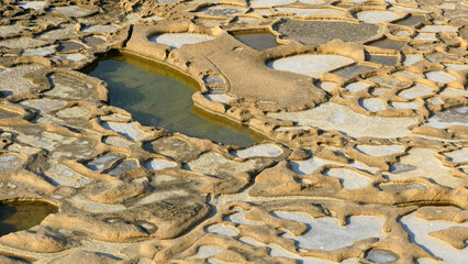 Interesting patterns made by Sea salt production on the island of Gozo.  Ancient salt pans