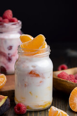 Milk yogurt with tangerine, close up