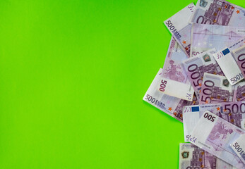 500 euro banknotes on a green background
