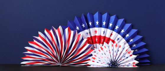 American Flag paper fans decorations on dark blue background. Presidents Day, 4th of July and other...