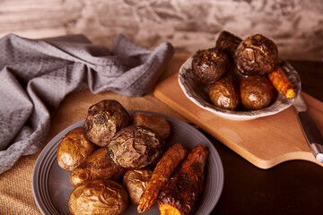 Baked healthy vegetables on rustic background - carrots, potatoes, beetroot. Whole food diet, Mediterranean diet.