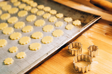Flower-shaped cookies before baking in the oven