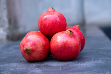 Ripe pomegranates on a dark background. Selective focus