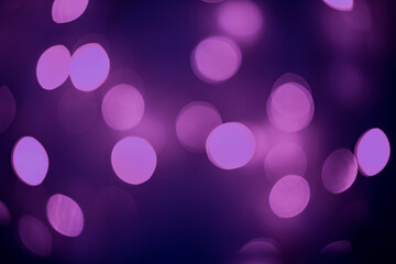 Purple cycle bokeh on black background