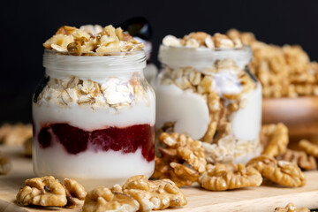 Fototapeta na wymiar yogurt made from milk with walnuts and muesli
