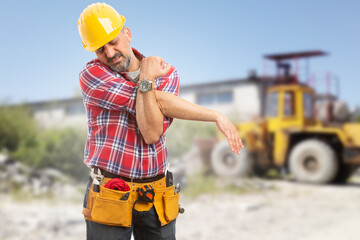Tired male worker stretching his arms