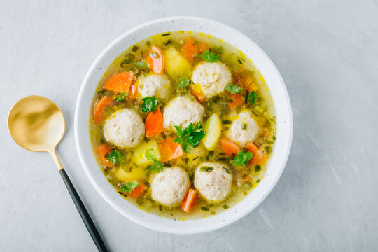 Meatballs soup. Chicken turkey vegetables meatballs soup with carrots and potatoes.