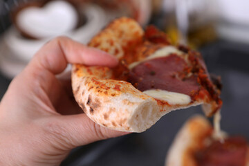Pizza with beef on the kitchen table